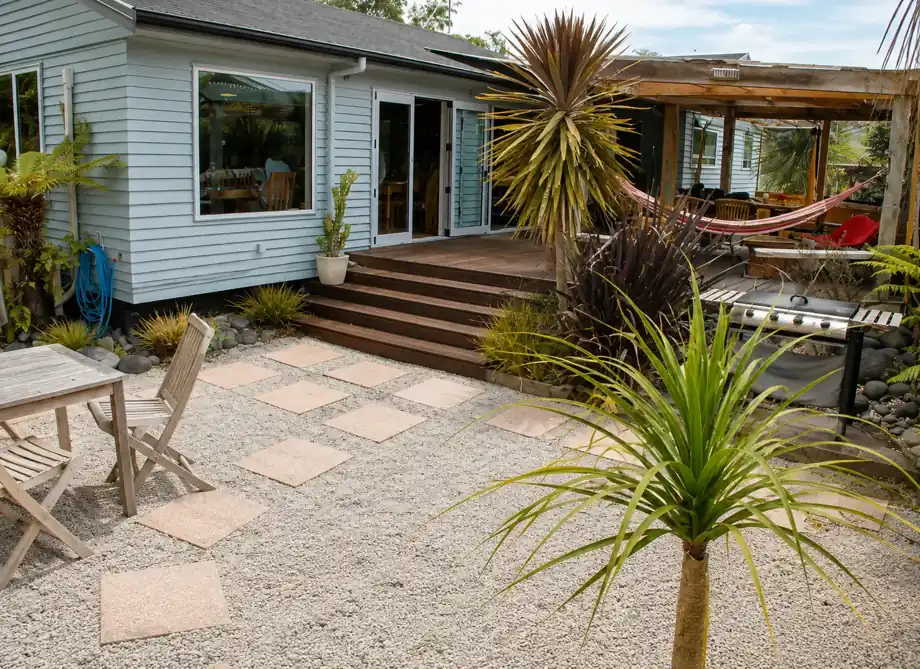 Timber deck, gravel courtyard and BBQ area outside the lodge